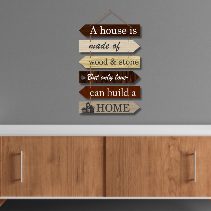 "A house is made of wood and stone, but only love can build a home wall hanging.