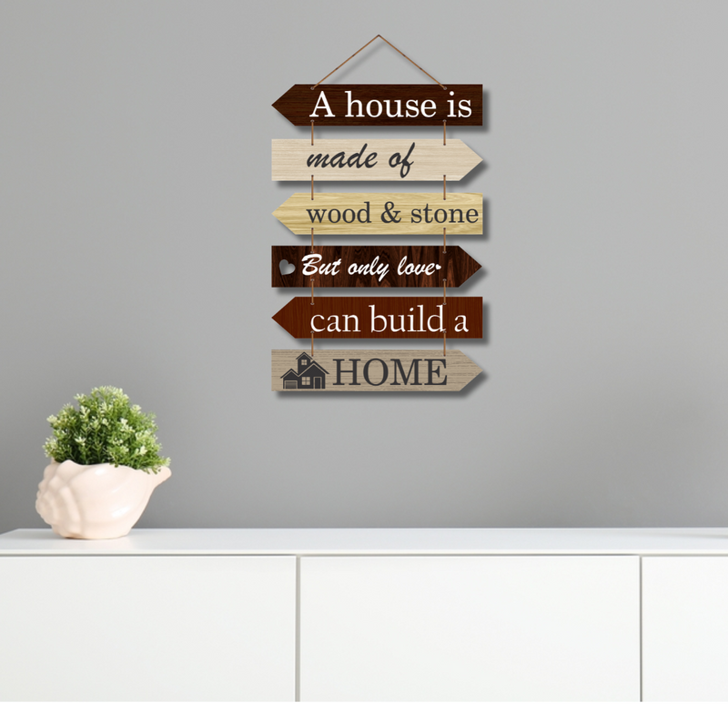 "A house is made of wood and stone, but only love can build a home wall hanging.