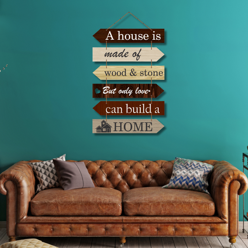 "A house is made of wood and stone, but only love can build a home wall hanging.